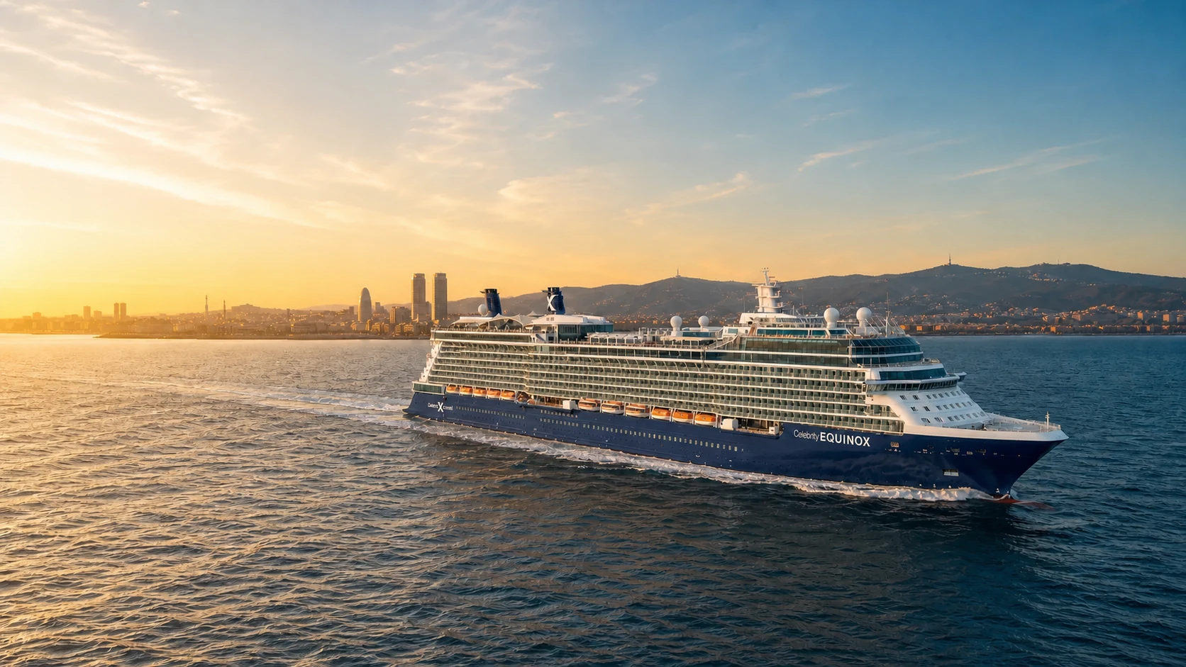 Celebrity Equinox sailing past Barcelona at golden hour